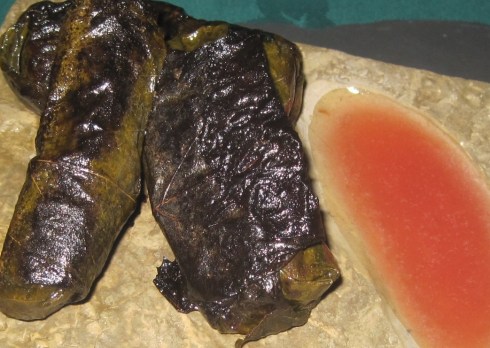 Crocodile wrapped in vine leaves