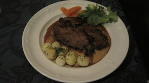 Whale steak in peppercorn sauce